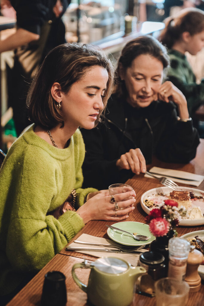 Guests enjoying food together at Hot Poppy Cafe